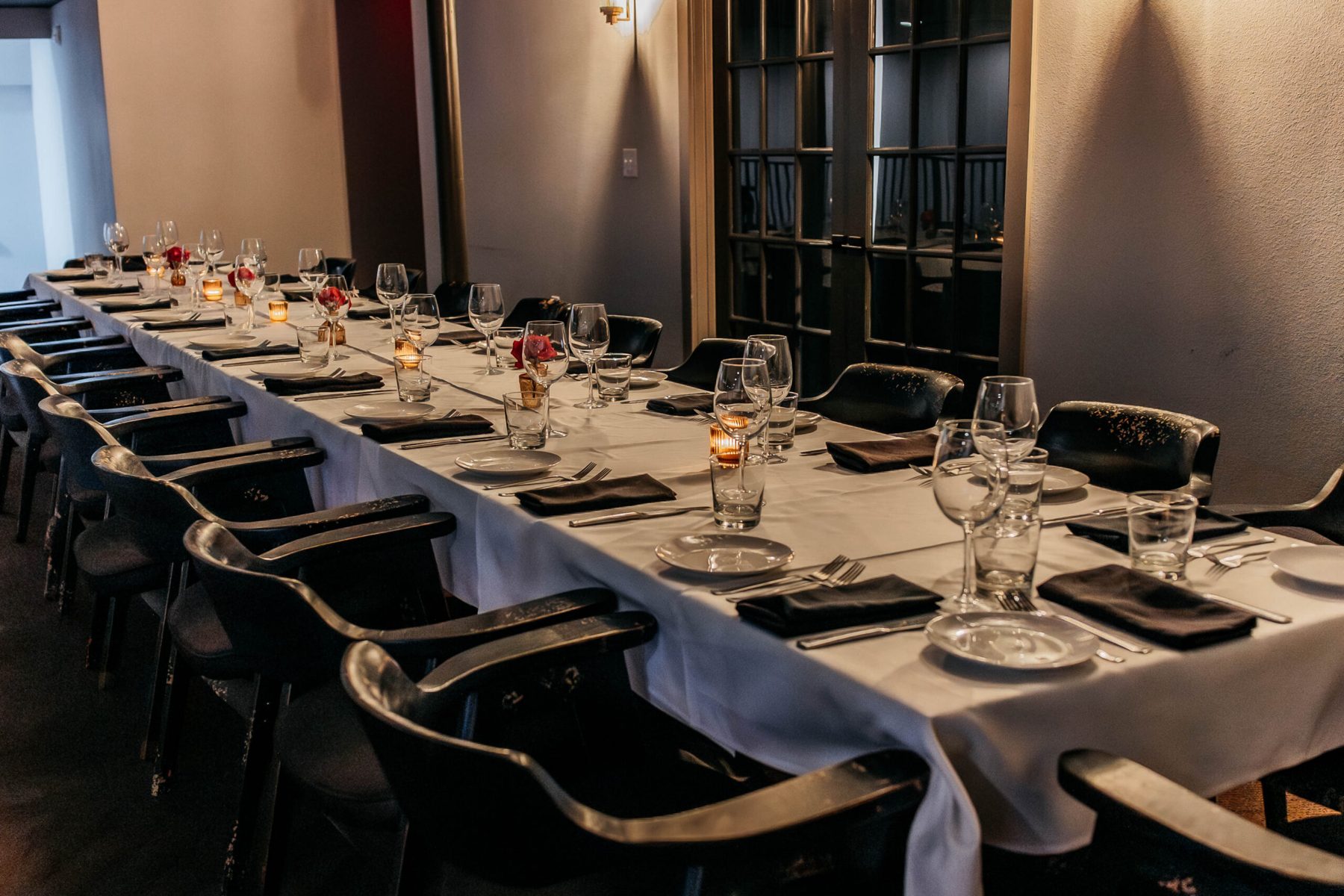 A long private table set for dinner